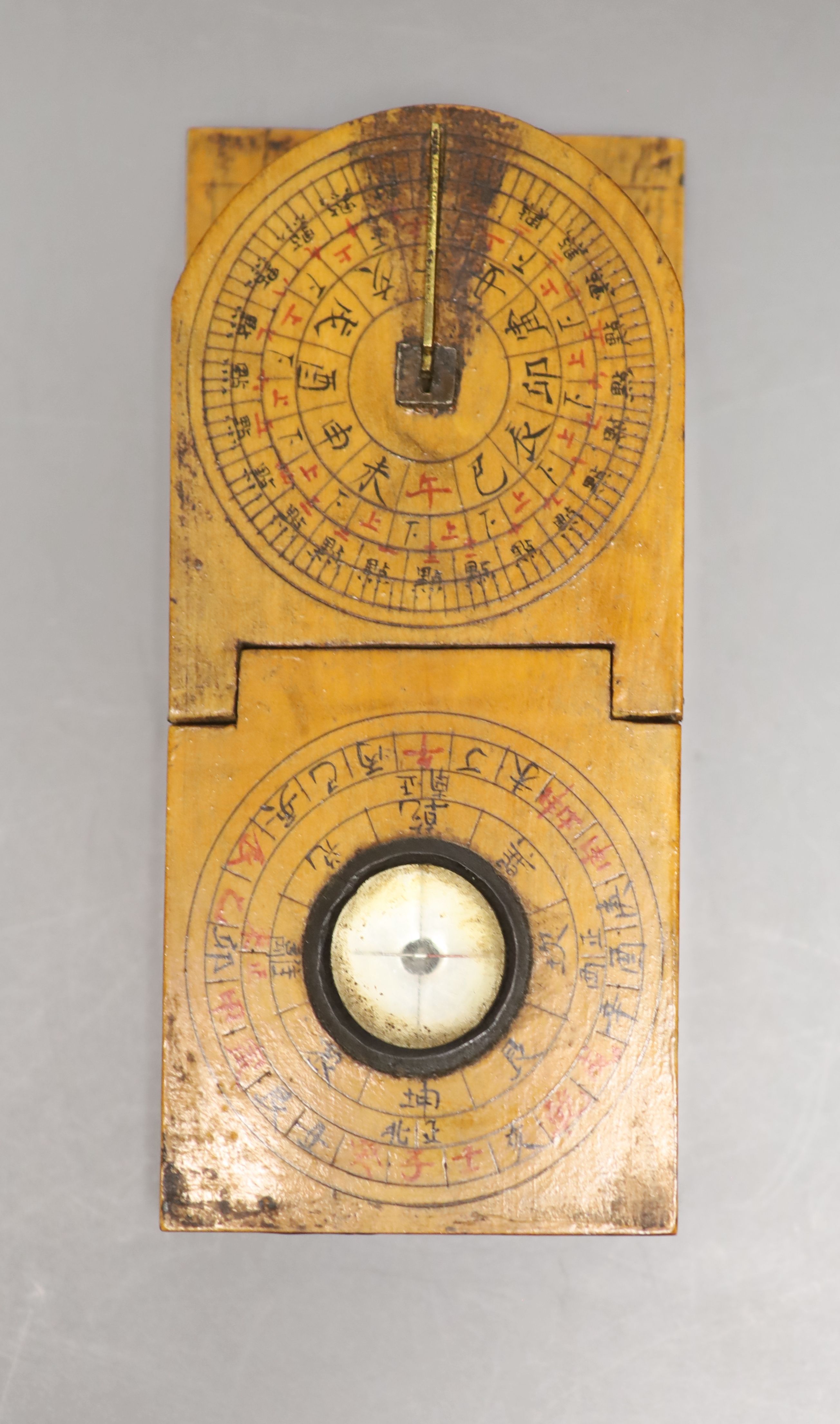 A reproduction Butterfield style scale and a Chinese compass/sundial, longest 12cm